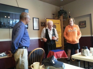 Magician Bob Eaton with two willing volunteers.